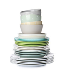 Beautiful ceramic plates and bowls isolated on white