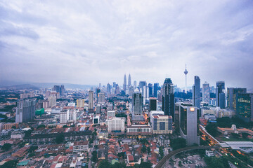 Beautiful cityscape with cloudy sky and skyscrapers. Megapolis Kuala-Lumpur, Malaysia.