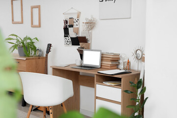 Interior of teenager's room with workplace and organizers