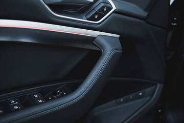 Naklejka premium Modern black subcompact electric crossover SUV with black interior. Details interior.