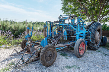 Harvester on lavender field in sunshine