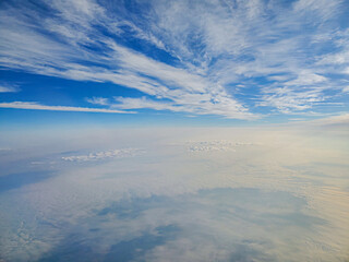 layers of clouds blue sky from airplane