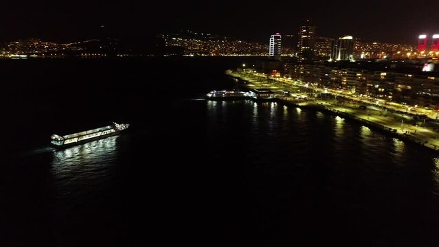Drone shot of the ferry sailing at night in Izmir