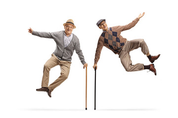 Two elderly men jumping with walking canes
