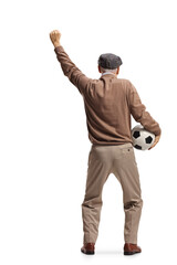 Rear view shot of a happy elderly man holding a football and cheering