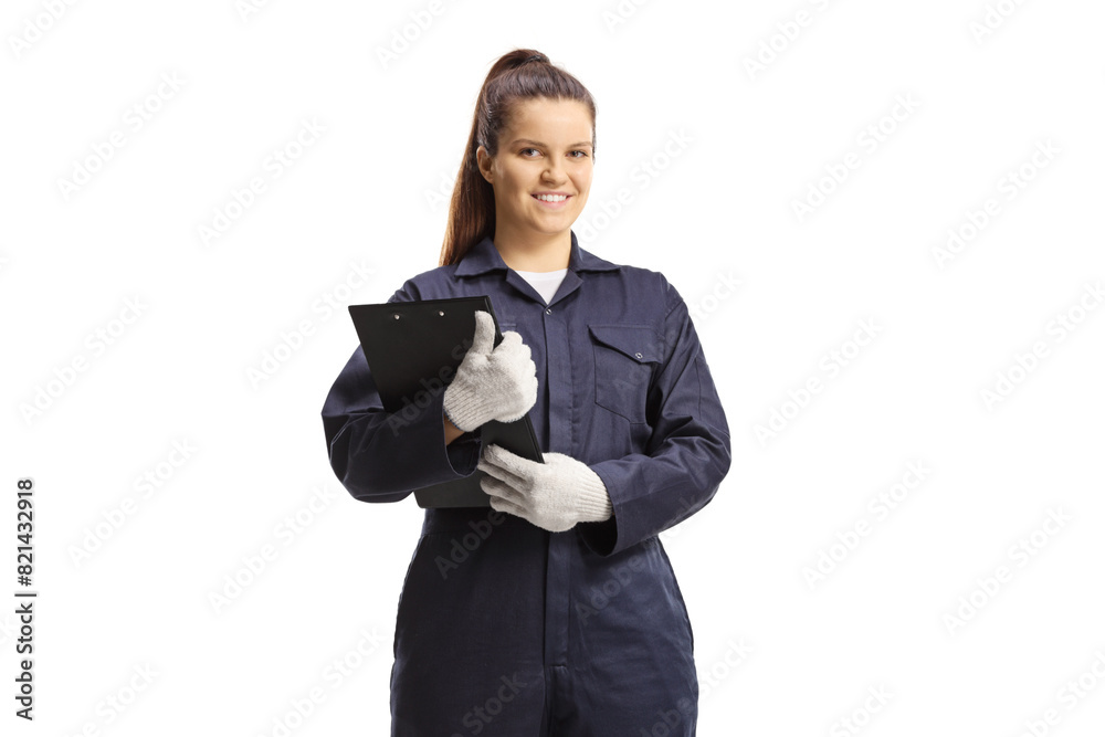 Wall mural Female mechanic in a uniform standing and looking at camera - Wall murals