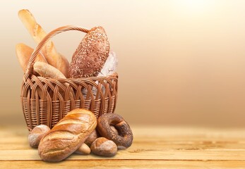 A basket full of fresh tasty bread on a desk