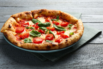 Delicious Margherita pizza on gray table, closeup