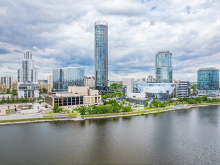 Yekaterinburg city with Buildings of Regional Government and Parliament, Dramatic Theatre, Iset Tower, Yeltsin Center, panoramic view at summer sunset.