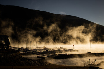 A steamy and foggy marina on Lake Dillon at sunrise on a cold winter morning in the Rocky Mountains (Summit County, Colorado, USA)