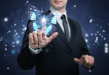 Digital Butterfly on hand of businessman. digital transformation