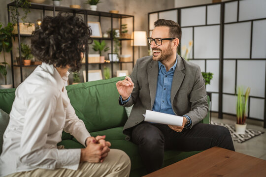 Mature woman talk with adult man about document she need to sign