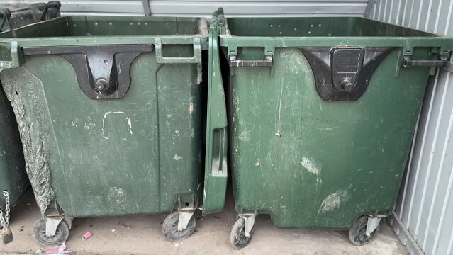 Green garbage can is used for waste containment and garbage collection located in special place for food waste