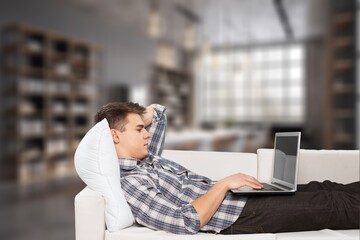 Cheerful Man work On Couch At Home On Weekend.