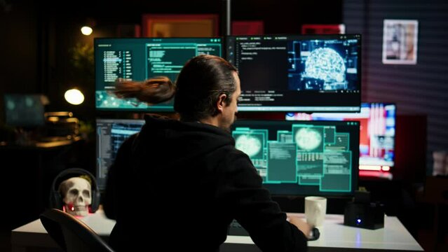 Hackers found by cybercriminal law enforcement escaping with stolen data on SSD after failing to conceal online identity. Criminal in hideout running from police after hacking into servers, camera B