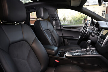 Inside of modern black car with leather seats
