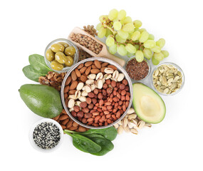 Different nuts, seeds and products high in healthy fats isolated on white, top view