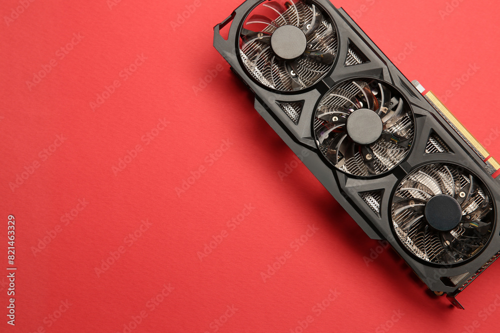 Fototapete one graphics card on red background, top view. space for text
