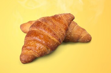 Fresh aroma tasty croissant at the desk