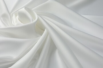 Texture of crumpled white silk fabric as background, closeup