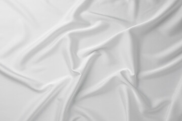 Texture of crumpled white silk fabric as background, top view