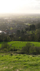 Obraz premium Scenic landscape overlooking the rural countryside of Somerset Levels from Glastonbury Tor in England UK