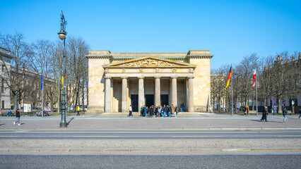 The Neue Wache, English: New Watchhouse, a historic building in Berlin, stands under clear skies,...