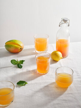 Homemade fermented kombucha drink  with fruit flavour on white background