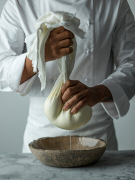 An action shot of a chef making Labneh