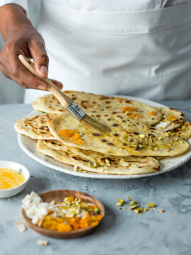 Peshwari Naan, brush melted butter and sprinkle with apricot, pistachio and coconut.fff