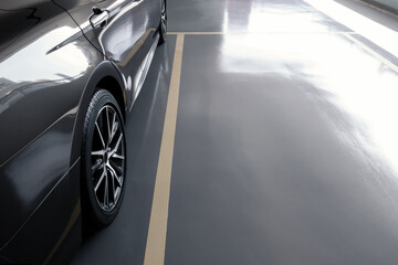 modern car in parking lot, anti slip coating floor for safety, car parked in the right position in...