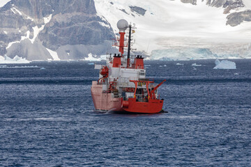 A Red Scientific Research Vessel Steaming Across the Seas, Antarctica Peninsula Near The Gullet, Adelaide Island