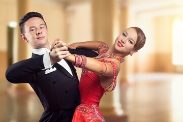 Beautiful youg couple of dancers evening dancing tango.
