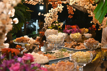 candy table chocolates party buffet wedding decoration dishes flowers arrangements restaurant dining table