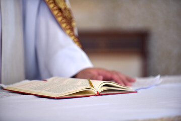 priest reading the gospel holy book wedding mass religious celebration