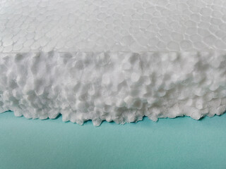pieces of white styrofoam on blue cardboard.