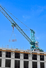 Building construction site with crane