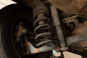 car in the garage, bottom view of the bottom, shock absorbers, wheel. transport service monitoring