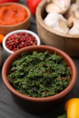 Fresh marinade in bowl on grey table, closeup