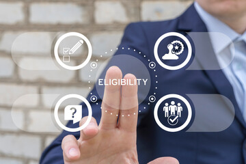 Business man working on virtual touch screen presses word: ELIGIBILITY. Eligibility concept. Are you eligible? Eligible, adept, adequate, capable, competent business finance concept.