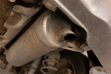 car in the garage, bottom view of the bottom and exhaust pipe. transport service monitoring