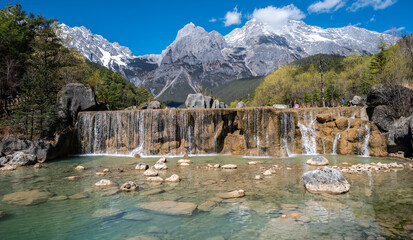 Waterfalls at the foothill of Jade Dragon Snow Mountain in Yulong Naxi Autonomous County, Lijiang,...