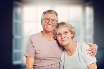 Happy loving senior couple standing at home