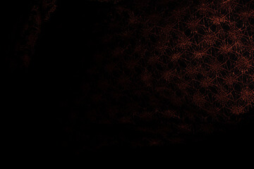 Copper red lace fabric flying in curve shape, Piece of textile copper red lace fabric throw fall in air. Black background isolated, dark shading environment