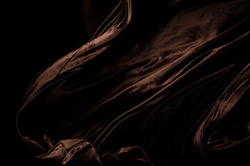 Brown velvet felt fabric flying in curve shape, Piece of textile Brown velvet felt fabric throw...