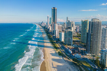 A aerial view of the Gold Coast Skyline behind the Gold Coast beach on a nice sunny day in Australia