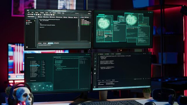 Lines of code running on computer monitors in empty room used by cybercriminal stealing sensitive information. Dangerous scripts on PC used for threatening network systems, panning shot