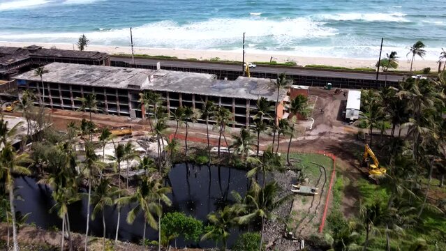 Aerial View of Coco Palms - Abandoned Historical Kauai Hotel in Disrepair with Waves and Palm Trees