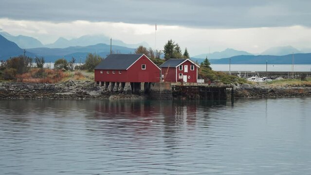 Boathouses, cottages, and a marina on a small island on the Lofoten archipelago.