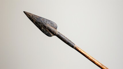 Close-up of ancient spearhead, made stone, attached to wooden shaft